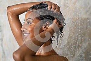 Woman bathing and washing hair photo