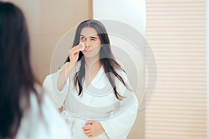 Woman in Bathrobe Cleaning Her Face with Make-up Remover