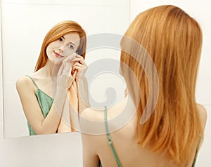 Woman in bathroom.