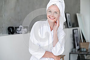 Woman in bathroom after washing hair with shampoo without parabens