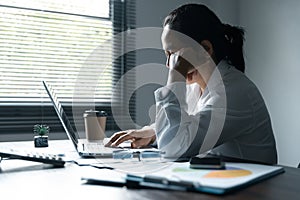 A woman battles depression and stress in her workplace, highlighting the challenges faced by professionals. This image captures