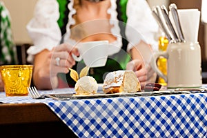 woman in Bavarian Tracht in restaurant or pub