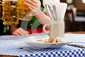 Woman in Bavarian Tracht in restaurant or pub