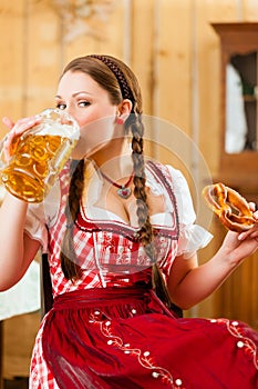 woman in Bavarian Tracht in restaurant or pub