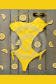 Woman beach accessories on wooden background.