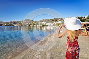 A woman at the beach Agioi Apostoloi Petries in Evia, Greece photo