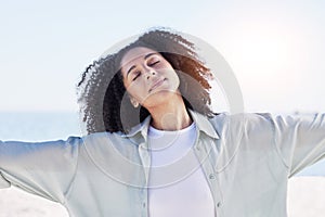 Woman at beach, freedom and travel with peace outdoor, mindfulness and calm with sunshine and fresh air. Young female