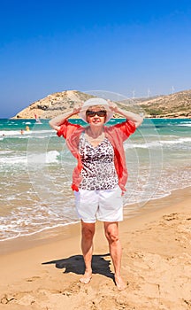 Woman on the beach of the isthmus Prasonisi. Rhodes Island