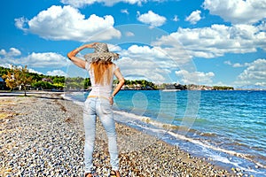 A woman at the beach Pefki in Evia, Greece