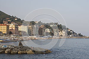 Woman at the beach reading a book Varazze, Italy