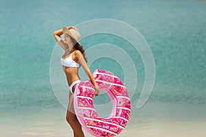 Woman on the Beach with a Rubber Ring.