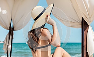 Woman on the beach in sun tent