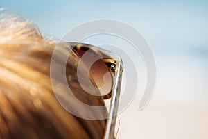 Woman on the beach. Sunglasses