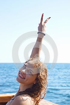 Woman on the beach in a swimsuit.