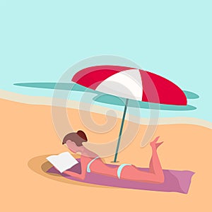 Woman on the beach under umbrella reads the book. Summer. Ocean