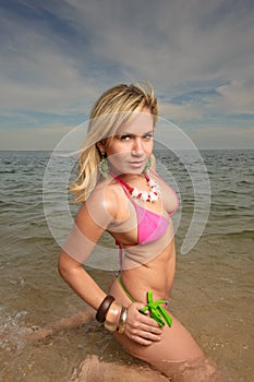 Woman at the beach on the water