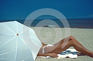 woman beach and white umbrella