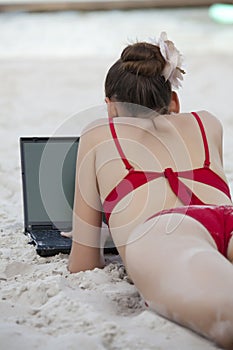 Woman on the beach working