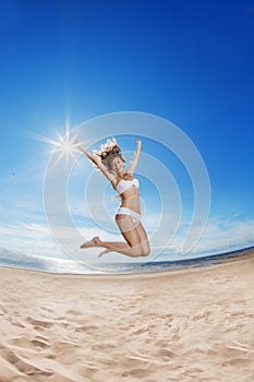 Woman on the beach. Young girl on the sand by sea.