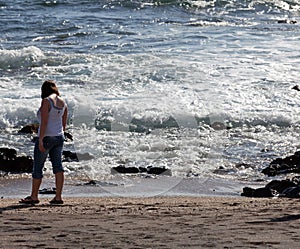 Woman beachcomb on Glass Beach