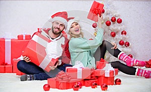 Woman and bearded man wear santa claus hat christmas tree background. Christmas eve with darling. Love is best gift