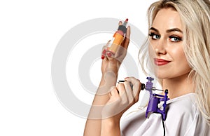Woman beautician cosmetologist hold tattoo machine gun isolated on white