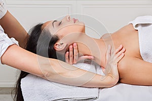 Woman beautician doctor make neck massage in spa wellness center