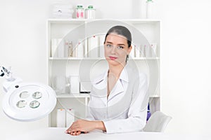 Woman beautician doctor at work in spa center. Portrait of a you