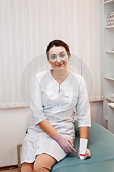 Woman beautician doctor at work in spa center. Portrait of a young female professional cosmetologist
