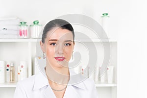 Woman beautician doctor at work in spa center. Portrait of a young female professional cosmetologist. Female employee in