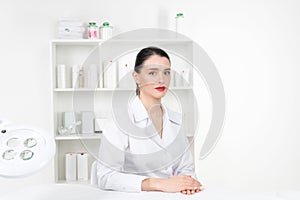 Woman beautician doctor at work in spa center. Portrait of a young female professional cosmetologist. Female employee in