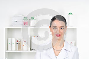 Woman beautician doctor at work in spa center. Portrait of a young female professional cosmetologist. Female employee in