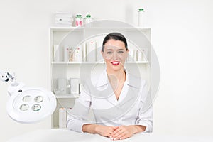 Woman beautician doctor at work in spa center. Portrait of a young female professional cosmetologist. Female employee in