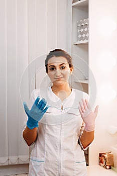 Woman beautician doctor at work in spa center. Portrait of a young female professional cosmetologist