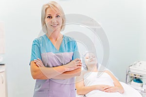 Woman beautician doctor at work in spa center photo