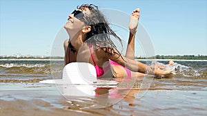 Woman with beautiful body on a beach