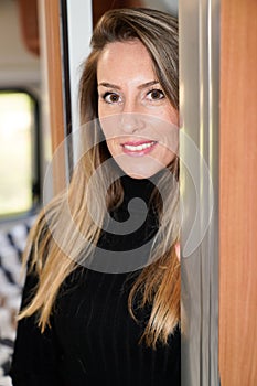 Woman beautiful in camper van motor rv home interior lifestyle in vanlife