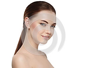 Woman with beautiful face, healthy skin and her hair on a back close up portrait studio on white