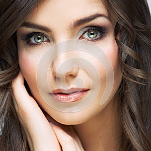 Woman beautiful face portrait. Skin care style face hand touchi