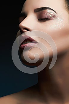 Woman.Beautiful Makeup.Gorgeous Glamour Lady Portrait.Sexy Lips. Beauty christmas Makeup with glitter eye shadows