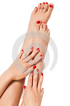 Woman with beautiful red finger and toenails photo