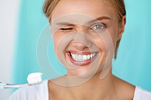 Woman With Beautiful Smile Brushing Healthy White Teeth