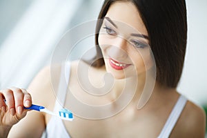 Woman With Beautiful Smile, Healthy White Teeth With Toothbrush.