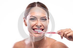 Woman with a beautiful smile preparing to brush her teeth