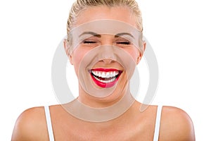 Woman with beautiful teeth laughs photo