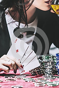 Woman beautiful young successful gambling in a casino at a table