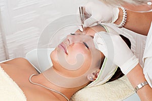 Woman beautifying herself in beauty spa