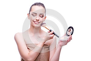 The woman in beauty concept applying make up using cosmetics