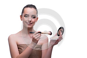 The woman in beauty concept applying make up using cosmetics