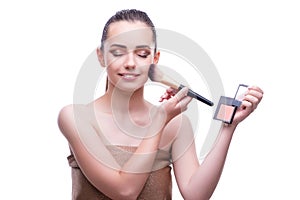 The woman in beauty concept applying make up using cosmetics